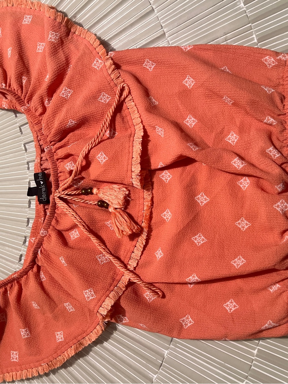 Darling Coral Off-Shoulder Tassel Peasant Top